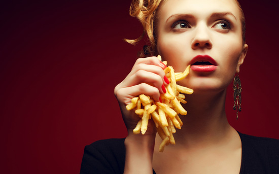 woman-crushing-french-fries